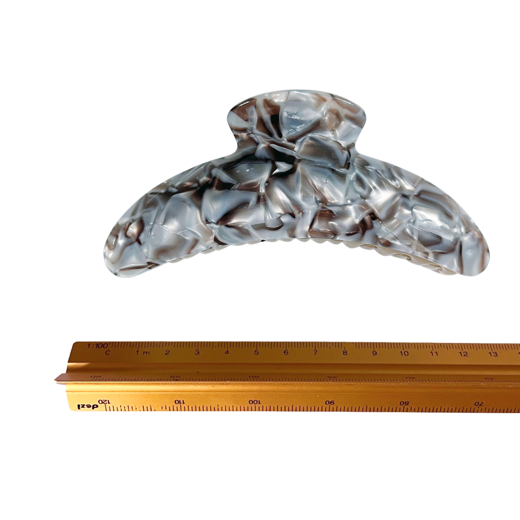 Meet DEMI!  A large curved classic shape hair claw with double grip finish. The curved design and wider body makes it perfect for that all up look, even for thicker hair.  Each clip comes in a branded Tort pouch (colours change seasonally).  Size: 13cm  Colour: marbled chocolate brown and warm silver  Material: eco-resin