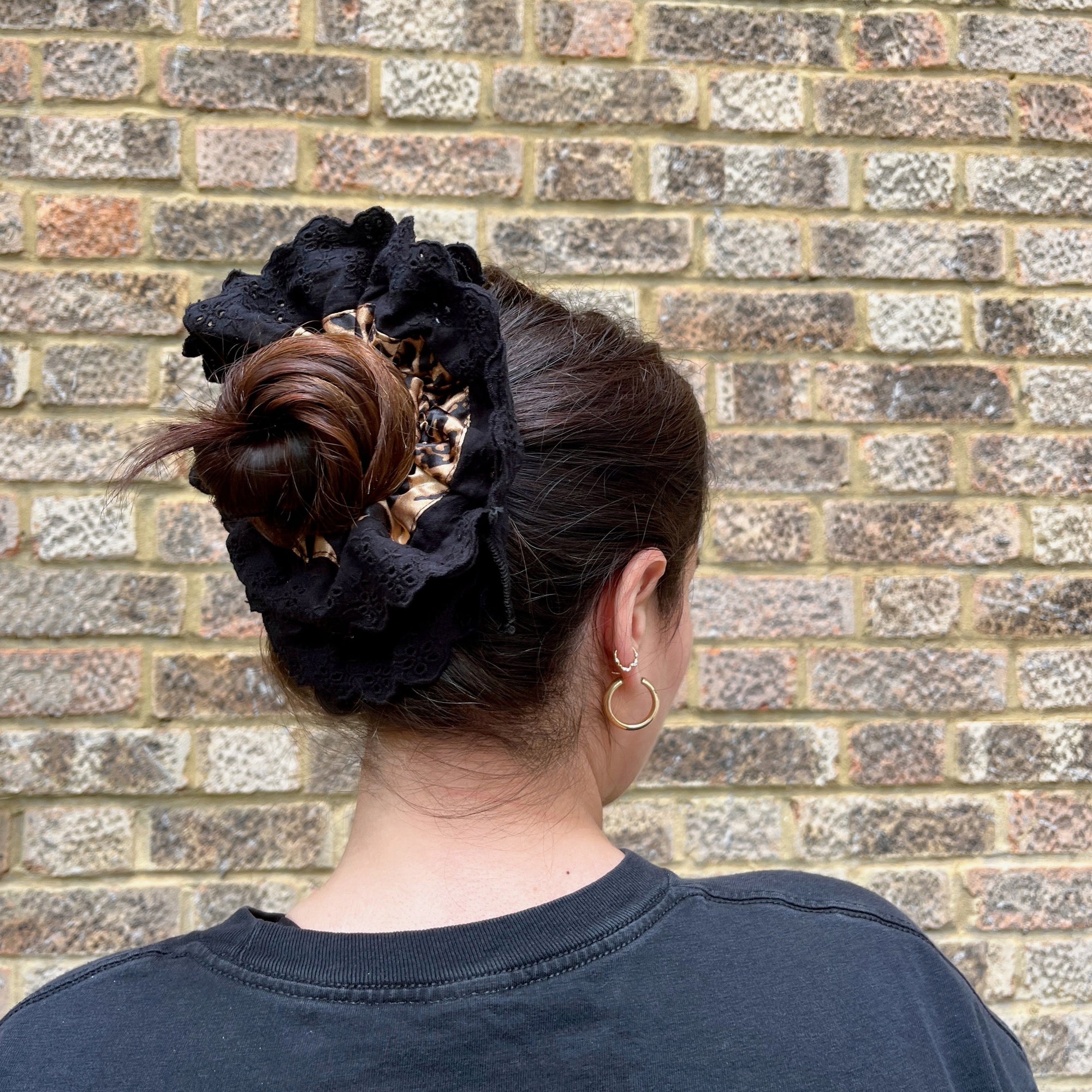Meet LOLA!  A scrunchie big enough to hold all hair. Two layers of broderie anglaise makes it perfect for an all up look on both fine and thicker hair, or great for securing a bun. The silky centre is kinder to the hair, especially if being worn overnight.  Each scrunchie comes with a pink ribbon tag on which can be used as a gift tag.  Size: approx 18cm  Colour: black lace with a classic leopard print silk centre  Material: Cotton and Satin