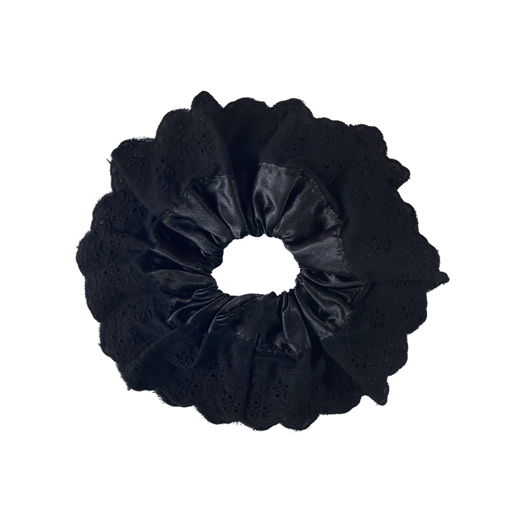 Meet LOLA!  A scrunchie big enough to hold all hair. Two layers of broderie anglaise makes it perfect for an all up look on both fine and thicker hair, or great for securing a bun. The silky centre is kinder to the hair, especially if being worn overnight.  Each scrunchie comes with a pink ribbon tag on which can be used as a gift tag.  Size: approx 18cm  Colour: black lace with a black silk centre  Material: Cotton and Satin