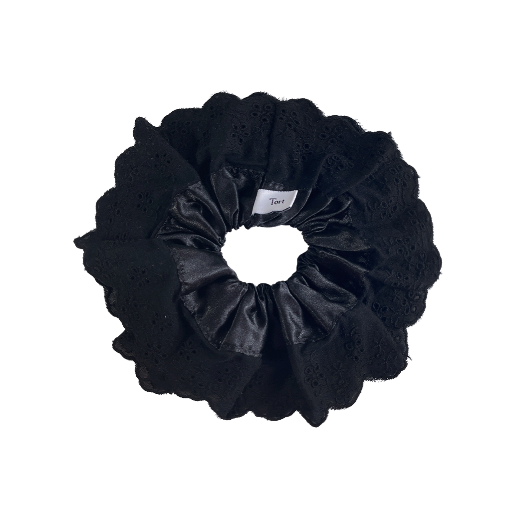 Meet LOLA!  A scrunchie big enough to hold all hair. Two layers of broderie anglaise makes it perfect for an all up look on both fine and thicker hair, or great for securing a bun. The silky centre is kinder to the hair, especially if being worn overnight.  Each scrunchie comes with a pink ribbon tag on which can be used as a gift tag.  Size: approx 18cm  Colour: black lace with a black silk centre  Material: Cotton and Satin