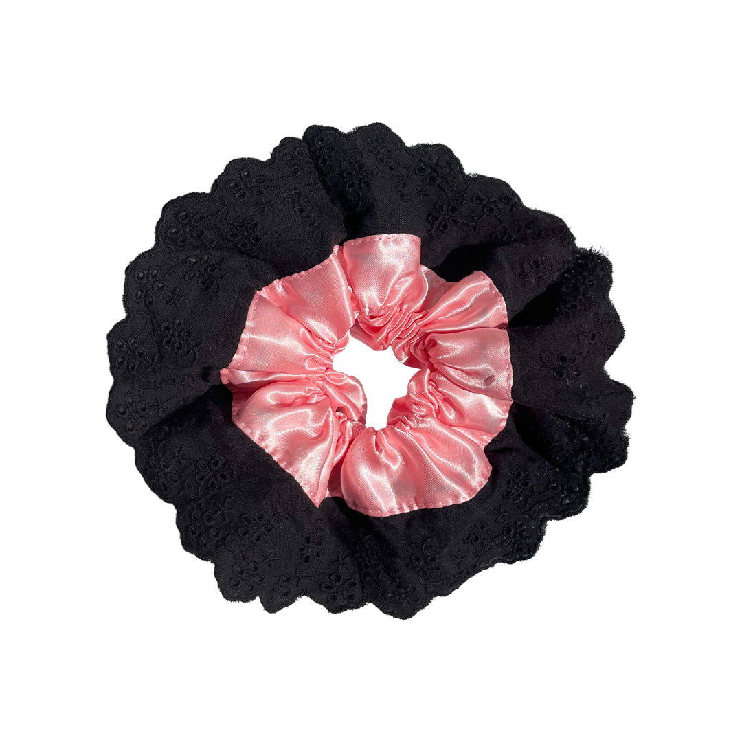 Meet LOLA!  A scrunchie big enough to hold all hair. Two layers of broderie anglaise makes it perfect for an all up look on both fine and thicker hair, or great for securing a bun. The silky centre is kinder to the hair, especially if being worn overnight.  Each scrunchie comes with a pink ribbon tag on which can be used as a gift tag.  Size: approx 18cm  Colour: black lace with a blush pink silk centre  Material: Cotton and Satin