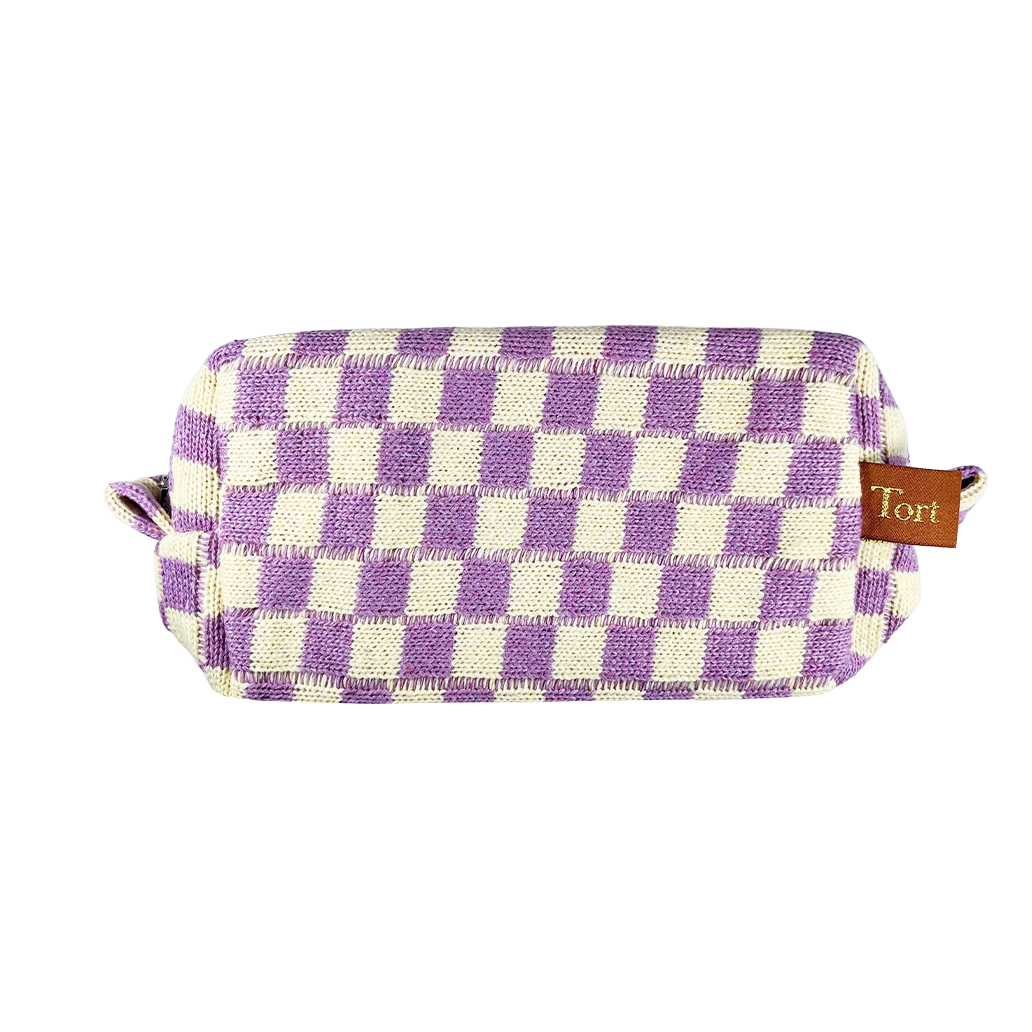 Meet the limited edition Tort Lilac Checkerboard Wash Bag  A woven purple and cream checkerboard wash bag, perfect for storing your favourite Tort pieces, makeup, toiletries or handbag essentials. The nylon lining makes it practical and easy to clean.  Size: 21cm x 10cm x 7cm  Colour: lilac and cream checkerboard 