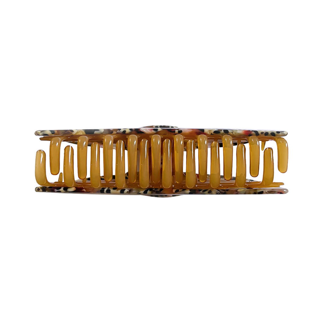 Meet ANNA!  A curved classic shape hair claw with double grip finish. The curved design makes it perfect for that all up look, and with the teeth being close together the grip works to hold all hair, from fine to thick.  Each clip comes in a branded Tort pouch (colours change seasonally).  Size: 12cm  Colour: multi-marble mixed with leopard print  Material: eco-resin