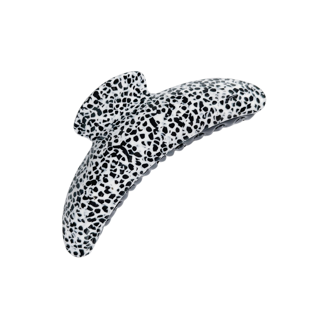 Meet DEMI!  A large curved classic shape hair claw with double grip finish. The curved design and wider body makes it perfect for that all up look, even for thicker hair.  Each clip comes in a branded Tort pouch (colours change seasonally).  Size: 13cm  Colour: black and white Dalmatian-like pattern  Material: eco-resin