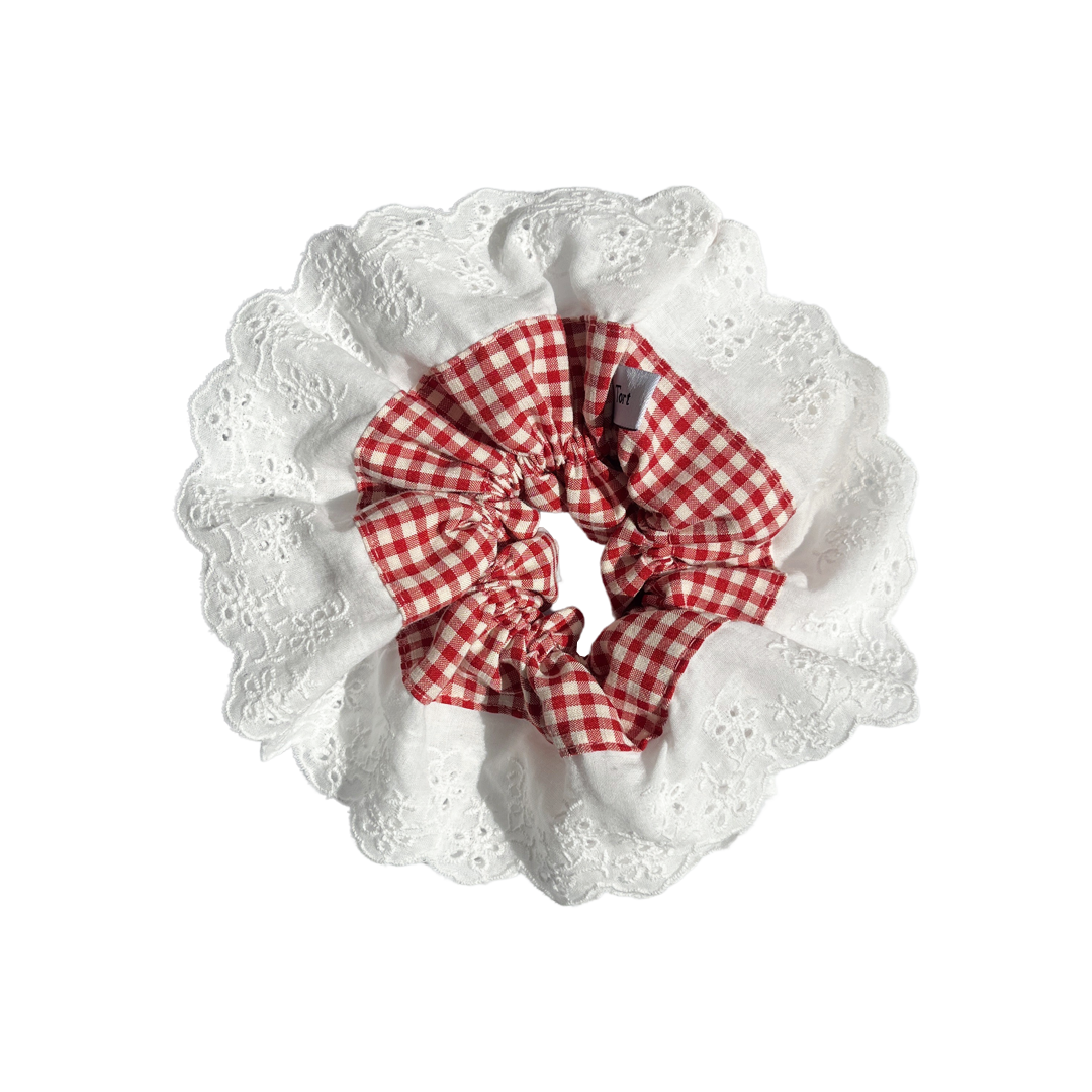 Meet LOLA!  A scrunchie big enough to hold all hair. Two layers of broderie anglaise makes it perfect for an all up look on both fine and thicker hair, or great for securing a bun.  Each scrunchie comes with a pink ribbon tag on which can be used as a gift tag.  Size: approx 18cm  Colour: white lace with a cherry red gingham centre  Material: Cotton
