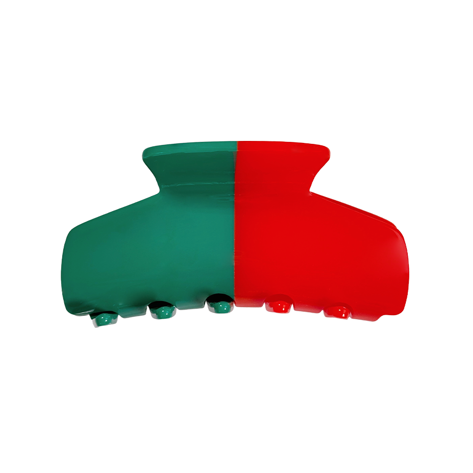 Green and red hair clip on a white background