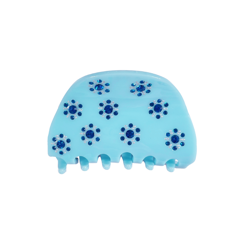 Meet RANA!  A medium to large silhouette claw in a half moon shape with rhinestone accents. The solid shape and close teeth, create a strong grip, making it great for fine hair and thick hair.  Each clip comes in a branded Tort pouch (colours change seasonally).  Size: 7.5cm  Colour: bubblegum blue with azure jewels and silver studs  Material: eco-resin
