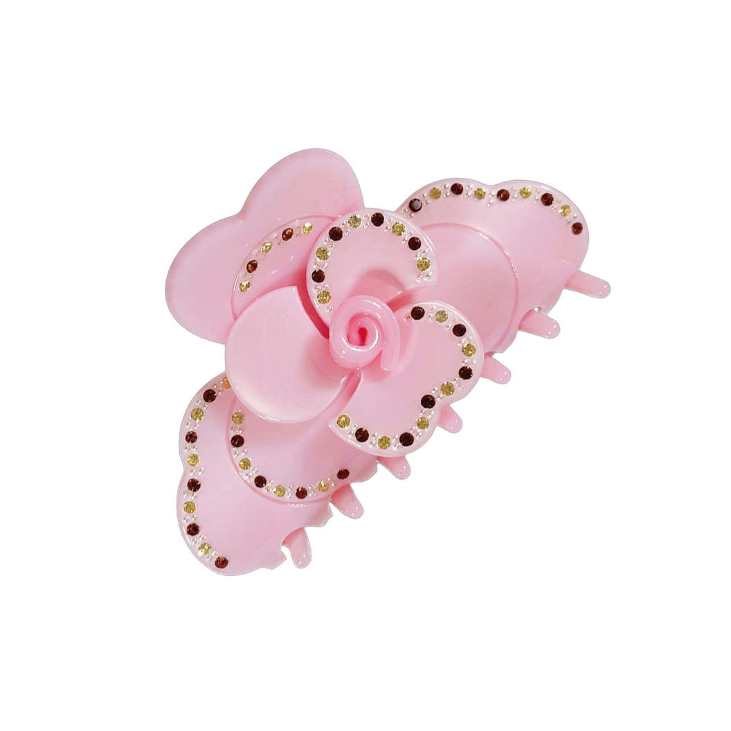Meet SUZY!  A medium-large clip with flower-shaped detail and rhinestone detailing on each side. Best for half up-half-down looks on thicker hair, while it’s great styled, any-way on medium to fine hair.  Each clip comes in a branded Tort pouch (colours change seasonally).  Size: 9cm  Colour: light pink with jonquil and topaz rhinestone accents and silver studs  Material: eco-resin 