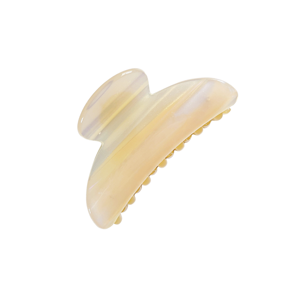 Meet TOTO!  One of our strongest clips in a classic curved top claw shape. Don’t let the small size fool you, as one of our strongest hair claws it works hard to hold all hair, even that difficult fine hair that slips out of clips.  Each clip comes in a branded Tort pouch (colours change seasonally).  Size: 7.5cm  Colour: pearlescent white and iridescent stripe  Material: eco-resin