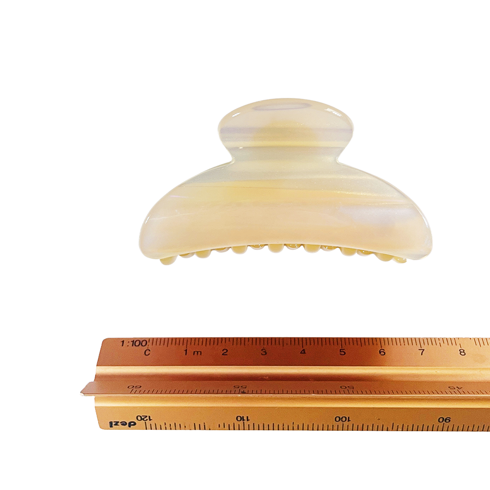 Meet TOTO!  One of our strongest clips in a classic curved top claw shape. Don’t let the small size fool you, as one of our strongest hair claws it works hard to hold all hair, even that difficult fine hair that slips out of clips.  Each clip comes in a branded Tort pouch (colours change seasonally).  Size: 7.5cm  Colour: pearlescent white and iridescent stripe  Material: eco-resin