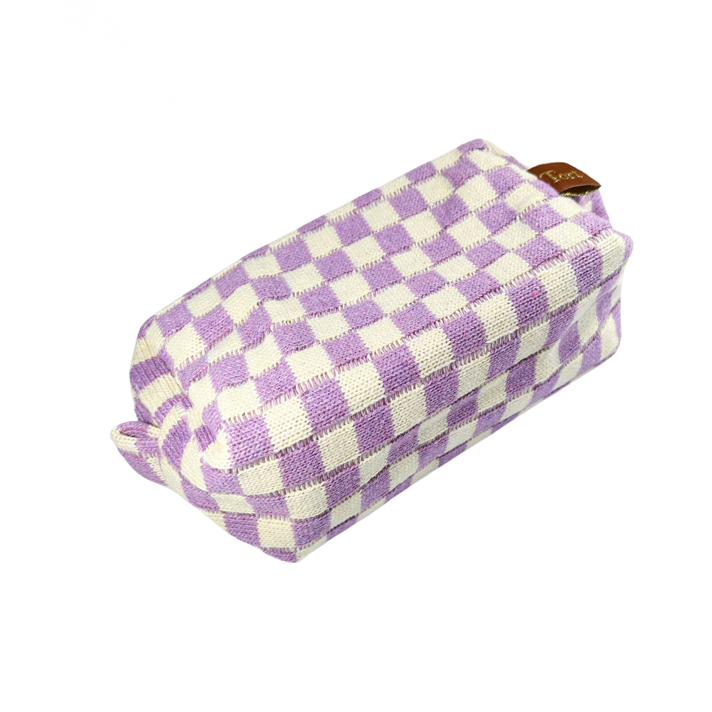 Meet the limited edition Tort Lilac Checkerboard Wash Bag  A woven purple and cream checkerboard wash bag, perfect for storing your favourite Tort pieces, makeup, toiletries or handbag essentials. The nylon lining makes it practical and easy to clean.  Size: 21cm x 10cm x 7cm  Colour: lilac and cream checkerboard 