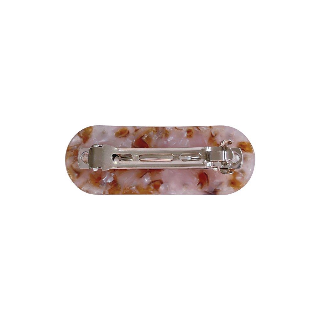 Meet ZADI!  A round edged rectangular hair clip with jewelled detailing and French barrette clasp. Clips to the hair securely and holds well. We recommend using it as a feature clip at the back of the hair above a ponytail or to secure a half up look.  Each clip comes in a branded Tort pouch (colours change seasonally).  Size: 7cm  Colour: marbled white, lilac and brown with bright orange crystal accents  Material: eco-resin
