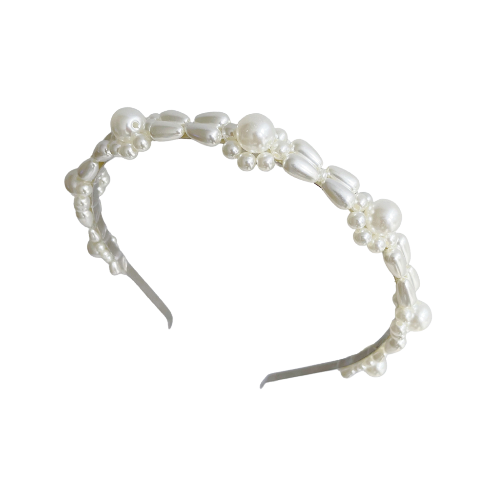 Meet CLOE!    An ivory faux pearl design on an antique silver headband. The softer black tip can be removed, however for comfort we would suggest leaving them on.    Each headband comes in a branded Tort pouch (colours change seasonally).  Size: can be bent into shape to suit your head shape  Colour: ivory pearl on an antique silver headband  Material: faux pearls, acrylic crystals and antique silver used so close up imperfections are expected   Headbands are non-refundable for hygiene reasons.