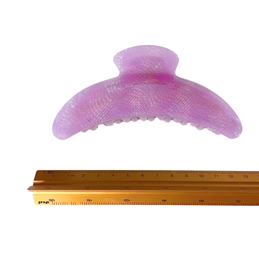 Meet DEMI!  A large curved classic shape hair claw with double grip finish. The curved design and wider body makes it perfect for that all up look, even for thicker hair.  Each clip comes in a branded Tort pouch (colours change seasonally).  Size: 13cm  Colour: lilac with a subtle iridescent snake-effect  Material: eco-resin