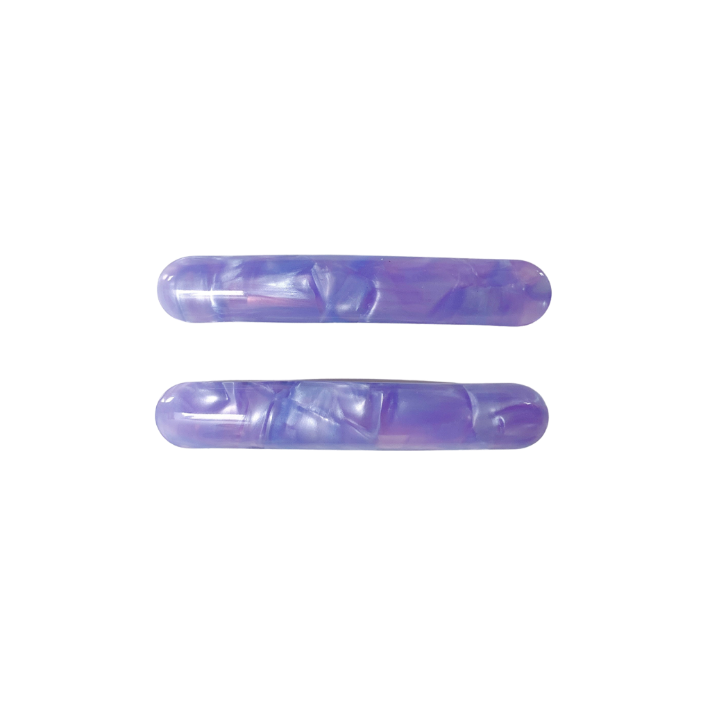 Meet EDIE!  A pair of classic long clips with round edges and a French barrette clasp. The secure clasp on the back ensures hair is held in place.  Each clip comes in a branded Tort pouch (colours change seasonally).  Size: 7cm  Colour: iridescent violet  Material: eco-resin