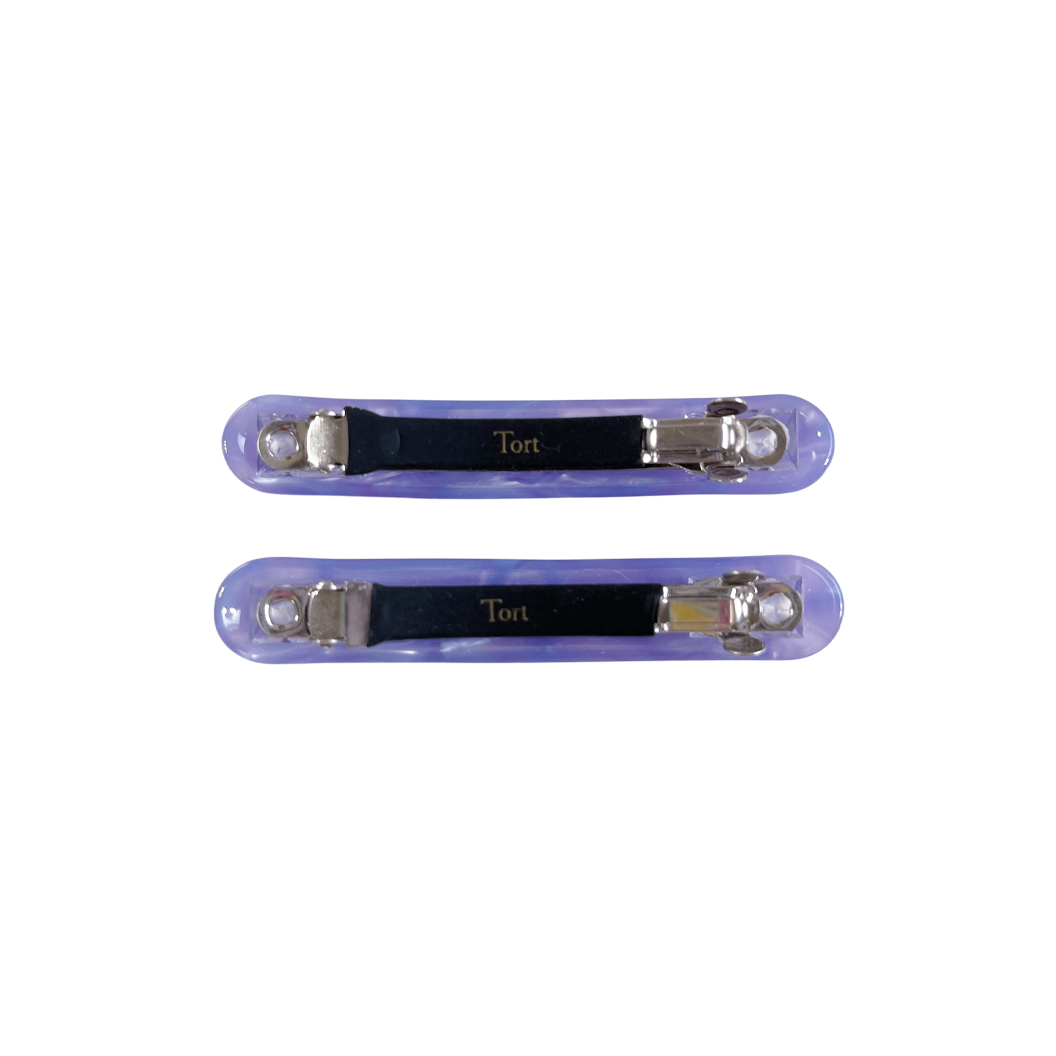 Meet EDIE!  A pair of classic long clips with round edges and a French barrette clasp. The secure clasp on the back ensures hair is held in place.  Each clip comes in a branded Tort pouch (colours change seasonally).  Size: 7cm  Colour: iridescent violet  Material: eco-resin