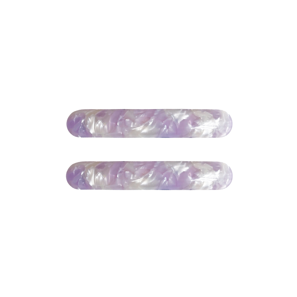 Meet EDIE!  A pair of classic long clips with round edges and a French barrette clasp. The secure clasp on the back ensures hair is held in place.  Each clip comes in a branded Tort pouch (colours change seasonally).  Size: 7cm  Colour: ivory and lilac tie-dye effect  Material: eco-resin