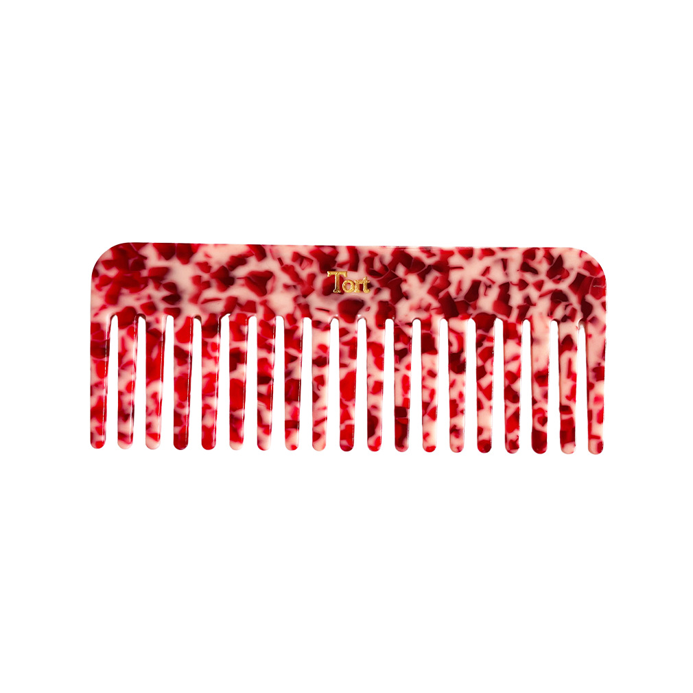 Meet ELVA!  A sturdy round-edged rectangle comb made from eco-resin. Designed with medium positioned rounded teeth so that hair retains texture and strength. Glides through wet or dry hair to untangle or tease after curling with tongs or straighteners, while preventing breakage, split ends and frizz.   Each comb comes in a branded Tort pouch (colours change seasonally).  Size: 15cm  Colour: marbled ruby red  Material: eco-resin   Combs are non-refundable for hygiene reasons.