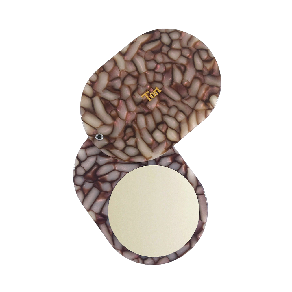 Meet JAYA!  A compact mirror is a handbag essential. Made from smooth, hand-poured eco-resin, the JAYA mirror is super cute with added protection and cleanliness through a sliding mechanism.  Each mirror comes in a branded Tort pouch (colours change seasonally).  Size: 10.5cm  Colour: pearlescent brown and pink mosaic effect  Material: eco-resin