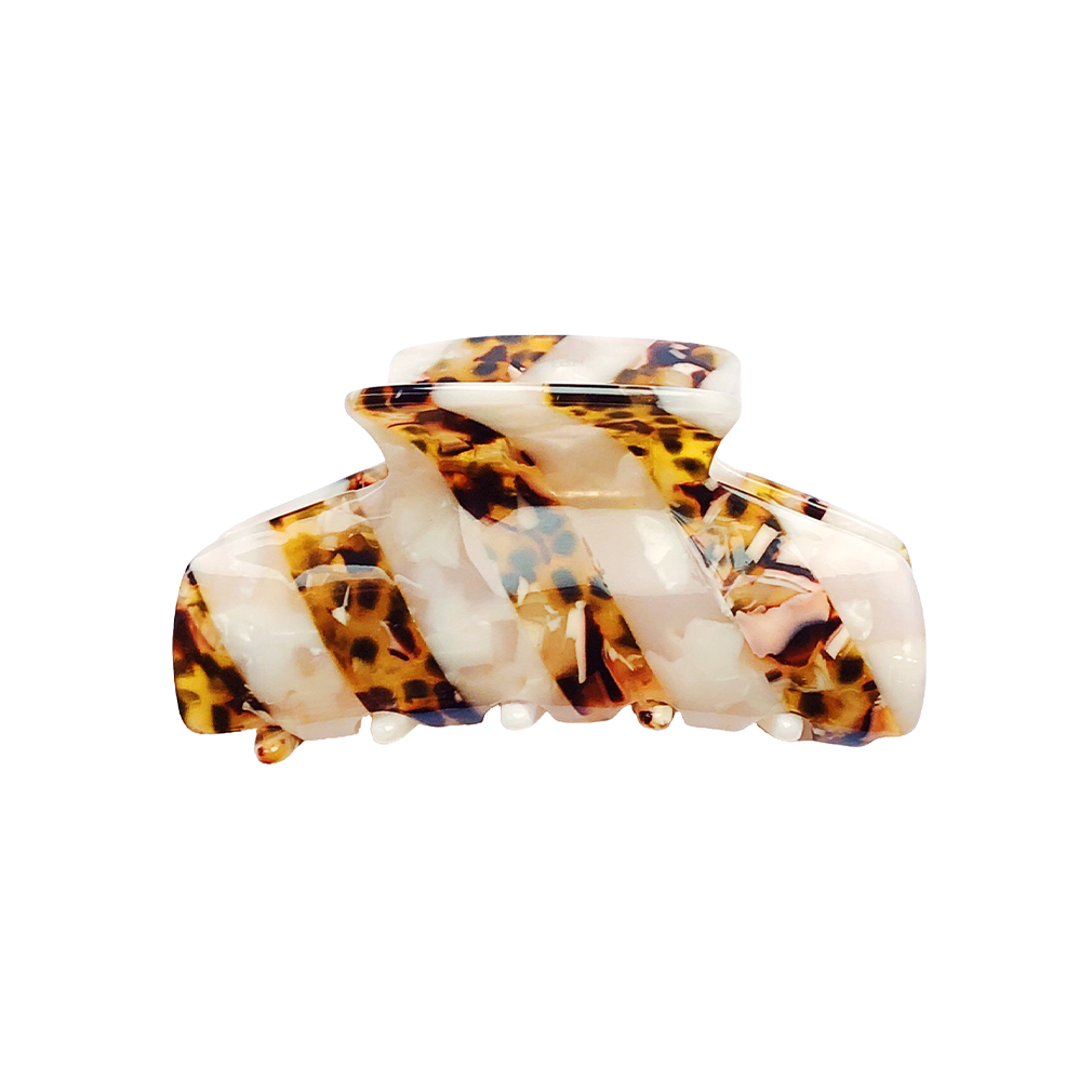 Meet LORA!  A medium sized silhouette claw in our signature stripes. Two resin patterns are merged together to create a colour combinations of dreams. The medium size makes it very easy to use and perfect for an all up look or securing a bun. For shorter hair it can be used for an all up look.  Each clip comes in a branded Tort pouch (colours change seasonally).  Size: 9cm  Colour: marbled moonstone and leopard tortoiseshell stripe  Material: eco-resin