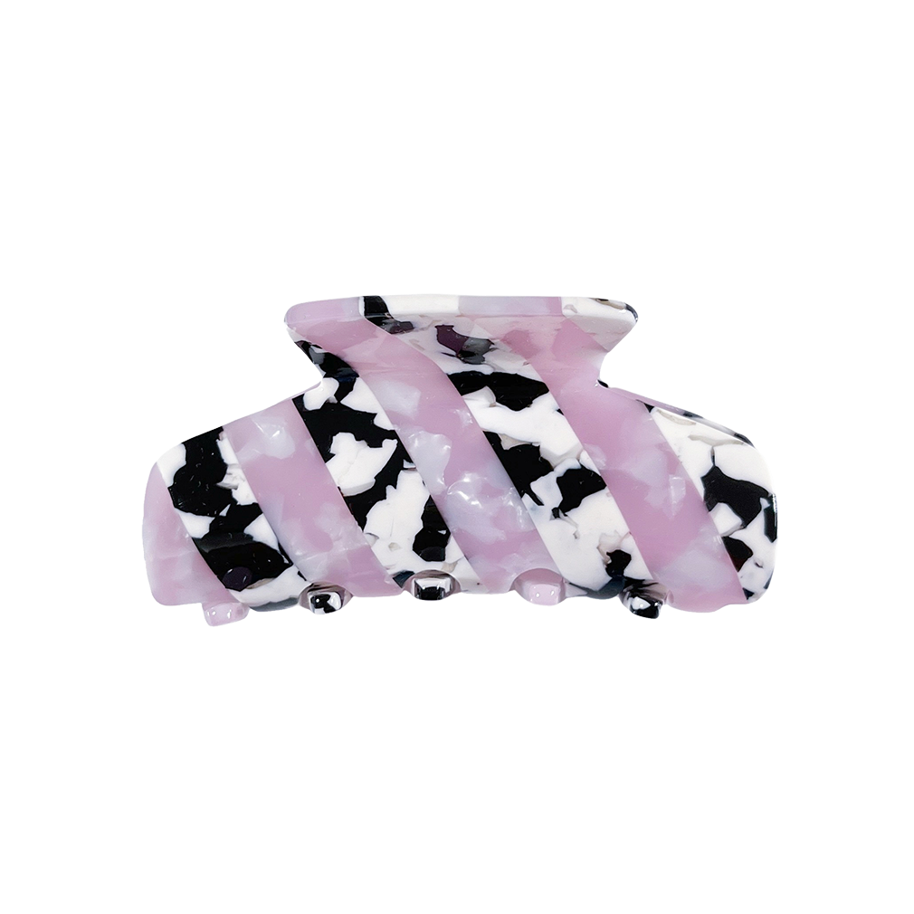 Meet LORA!  A medium sized silhouette claw in our signature stripes. Two resin patterns are merged together to create a colour combinations of dreams. The medium size makes it very easy to use and perfect for an all up look or securing a bun. For shorter hair it can be used for an all up look.  Each clip comes in a branded Tort pouch (colours change seasonally).  Size: 9cm  Colour: marbled baby pink and cow print stripe  Material: eco-resin