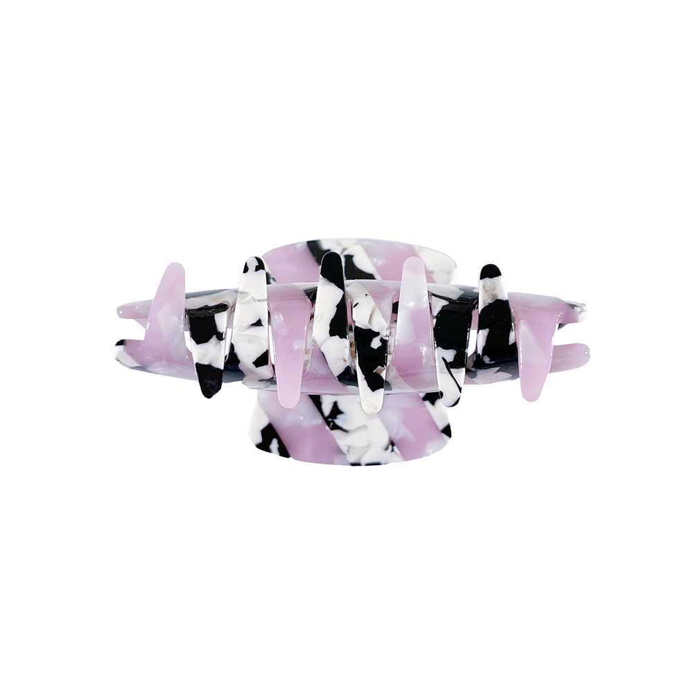 Meet LORA!  A medium sized silhouette claw in our signature stripes. Two resin patterns are merged together to create a colour combinations of dreams. The medium size makes it very easy to use and perfect for an all up look or securing a bun. For shorter hair it can be used for an all up look.  Each clip comes in a branded Tort pouch (colours change seasonally).  Size: 9cm  Colour: marbled baby pink and cow print stripe  Material: eco-resin