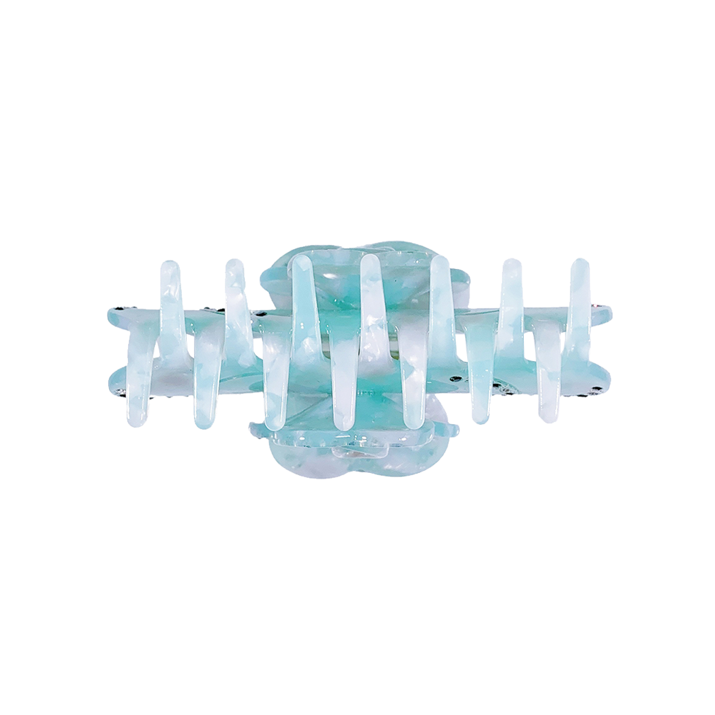 Meet SUZY!  A medium-large clip with flower-shaped detail and rhinestone detailing on each side. Best for half up-half-down looks on thicker hair, while it’s great styled, any-way on medium to fine hair.  Each clip comes in a branded Tort pouch (colours change seasonally).  Size: 9cm  Colour: ice pale blue with contrasting rhinestone accents and silver studs  Material: eco-resin
