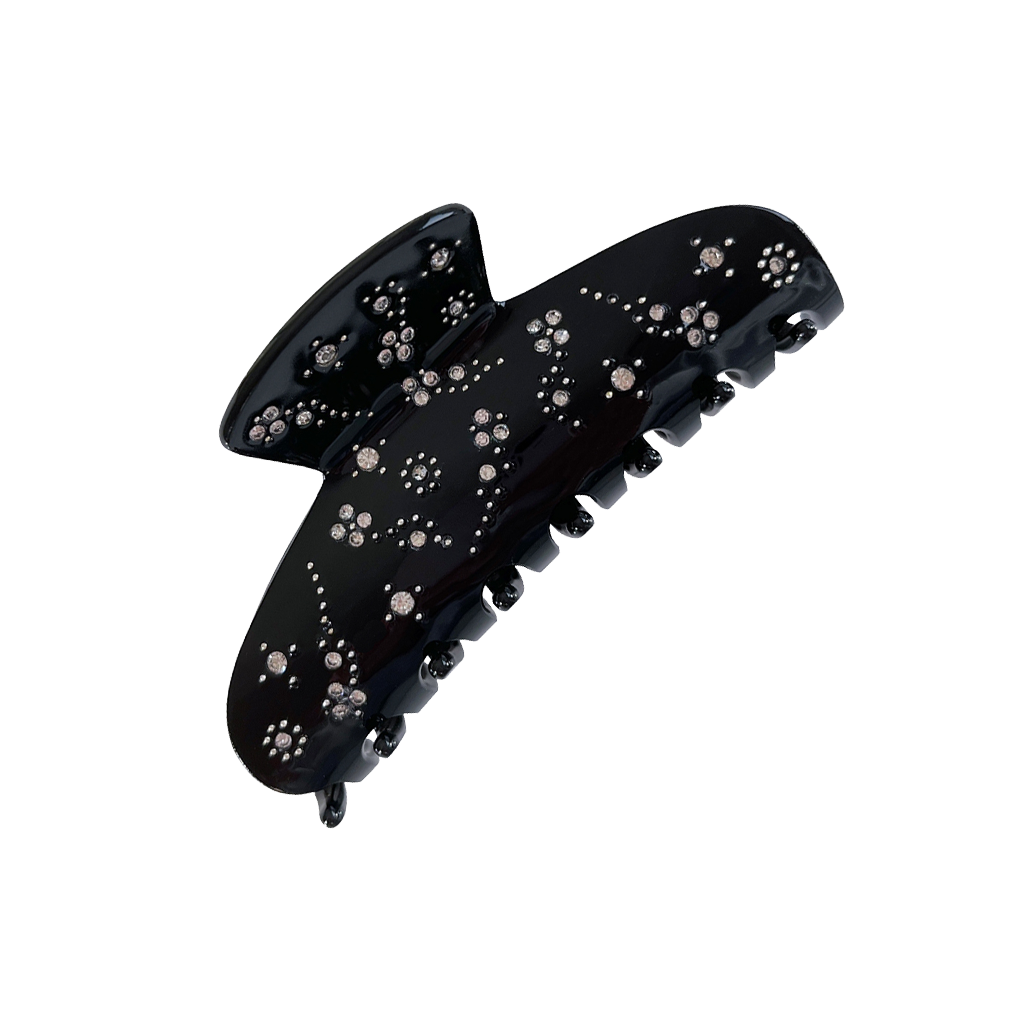 Meet YARA!  A medium-large slimmer silhouette shaped hair claw with rhinestone and delicate stud detail. The shorter close together teeth allow for it to hold even fine hair in place.   Each clip comes in a branded Tort pouch (colours change seasonally).  Size: 10cm  Colour: jet black with crystal jewels and silver studs  Material: eco-resin