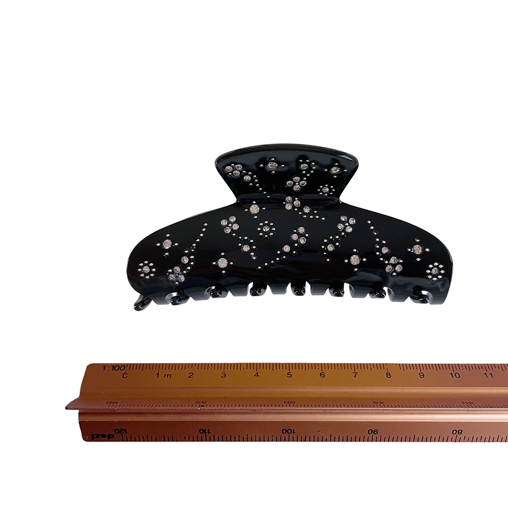 Meet YARA!  A medium-large slimmer silhouette shaped hair claw with rhinestone and delicate stud detail. The shorter close together teeth allow for it to hold even fine hair in place.   Each clip comes in a branded Tort pouch (colours change seasonally).  Size: 10cm  Colour: jet black with crystal jewels and silver studs  Material: eco-resin